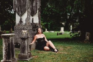 Ancient stone monuments and crosses in a historic cemetery setting.