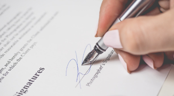 Signing signature for contact with pen.