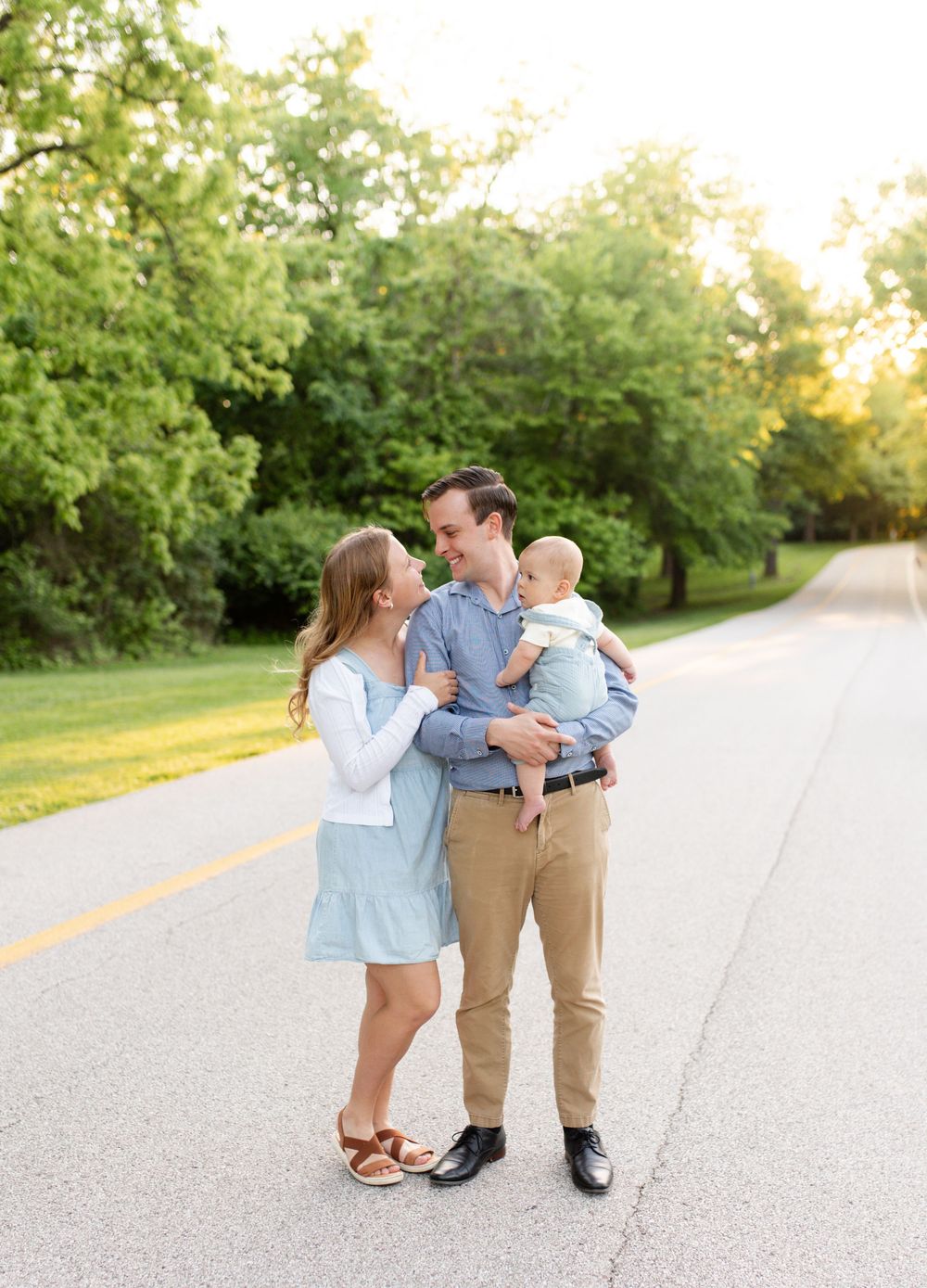 Parents holding baby during family photos in O’Fallon MO
