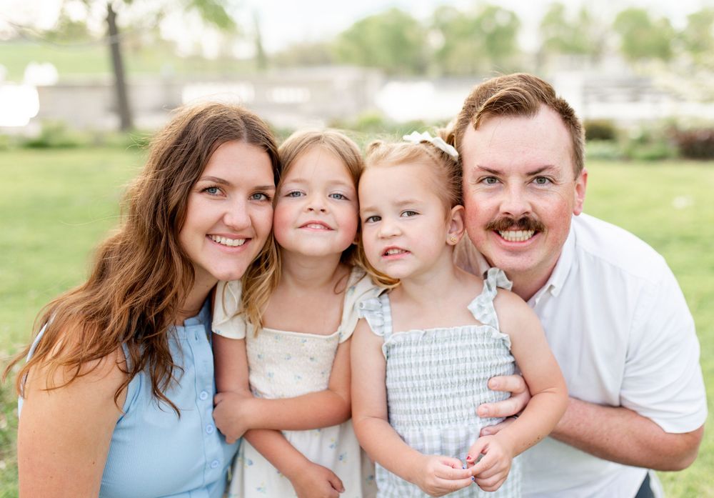 Family of four during outdoor photos in O’Fallon Missouri