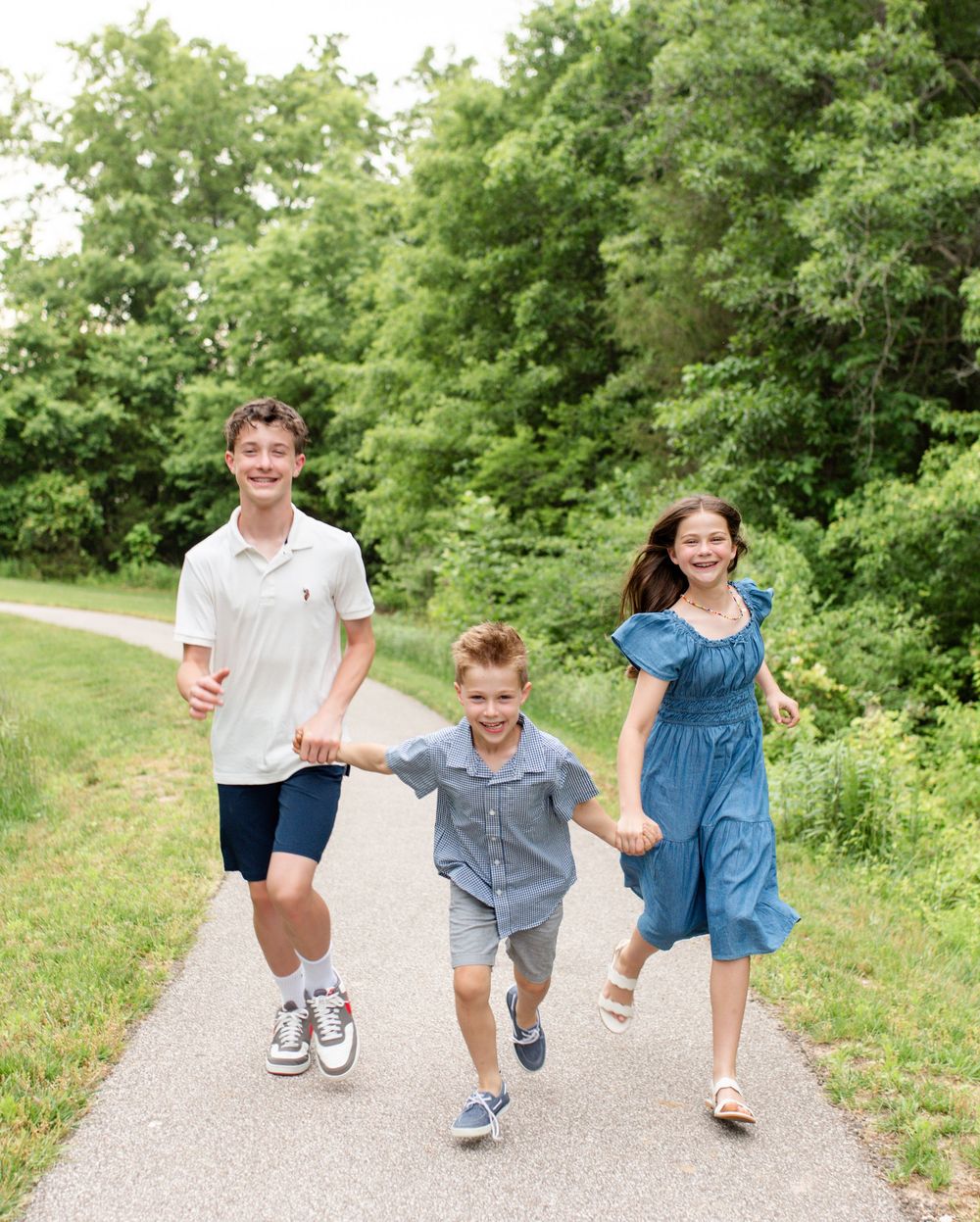 Children playing during outdoor photo session in O’Fallon Missouri