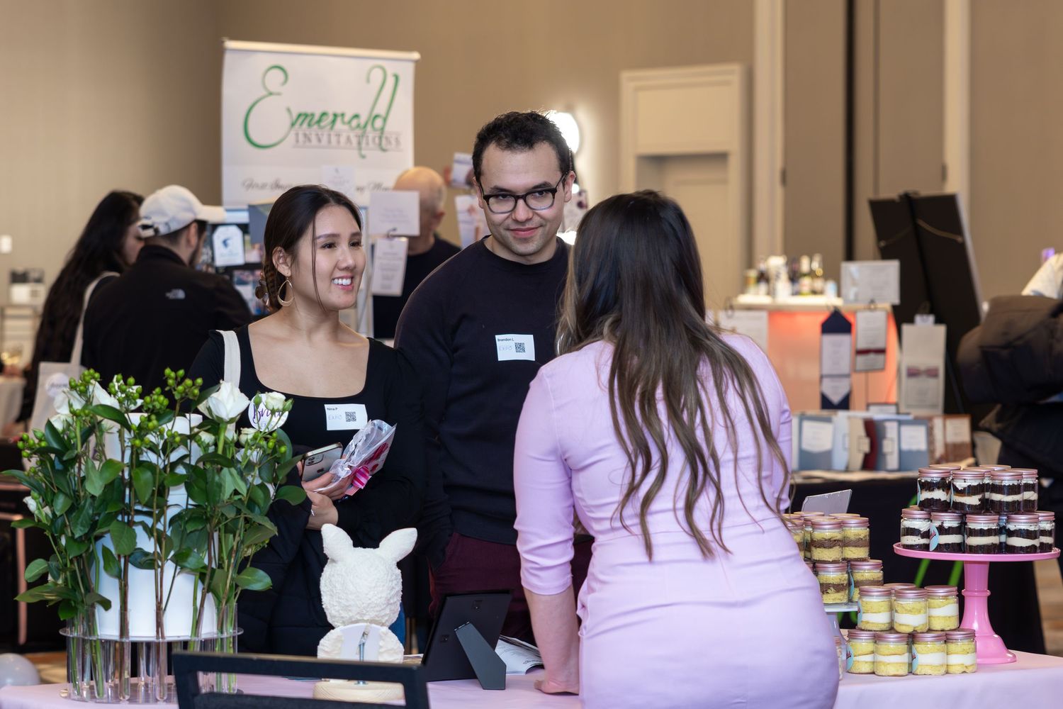 Vendors and displays set up at a shopping event or marketplace.