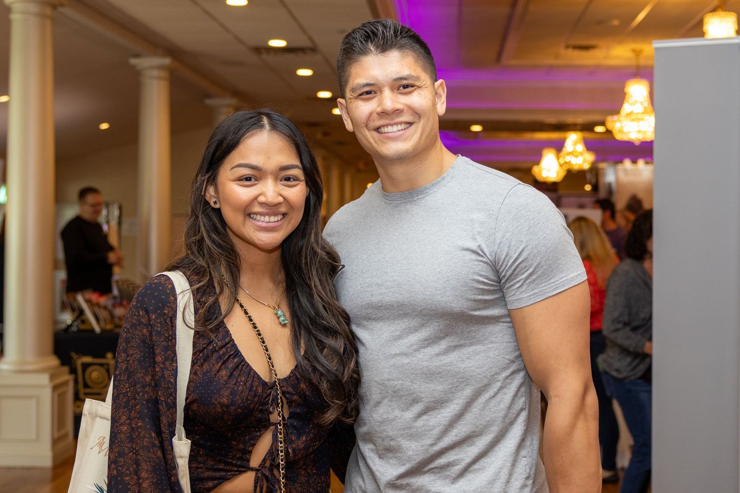 Attendees enjoying themselves at a professional networking event in an elegant venue.