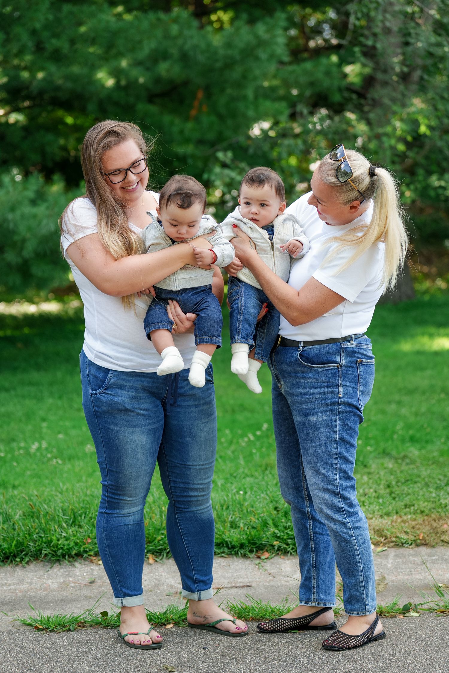 A series of photos showing people in matching denim jeans and white shirts standing together outdoors in a garden setting.