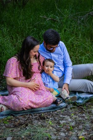 a young family on a blanket
