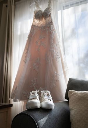 a wedding dress in a window