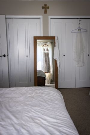 a wedding dress in a mirror.