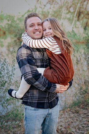 a father & daughter at at lake