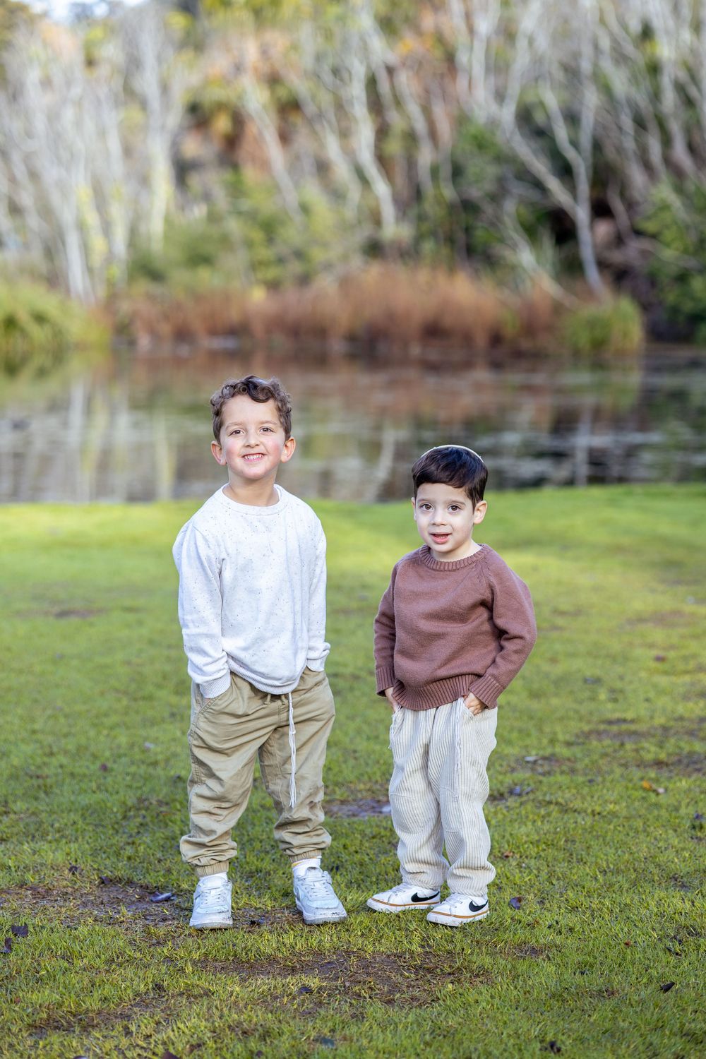 Cute boys posing for camera in fun Melbourne family photoshoot.