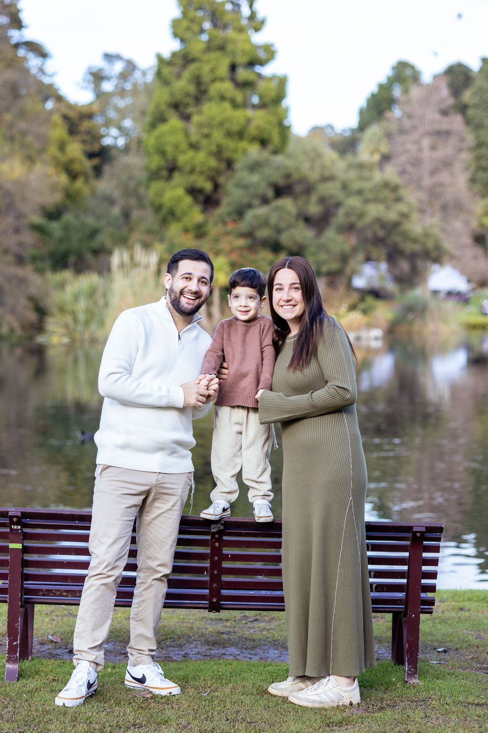 Young family with child at Royal Botanic Gardens, Melbourne, joyful photoshoot.