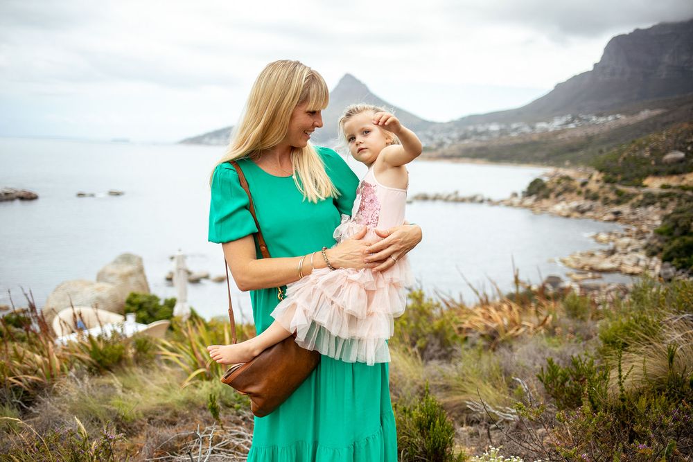 mother and daughter touching moment during photoshoot