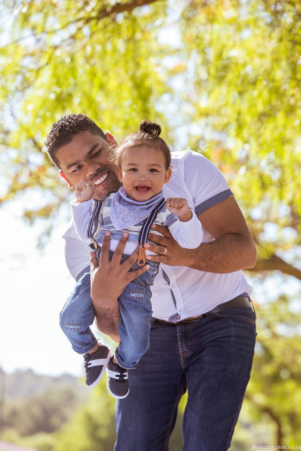 dad and son joyful moment during photoshoot