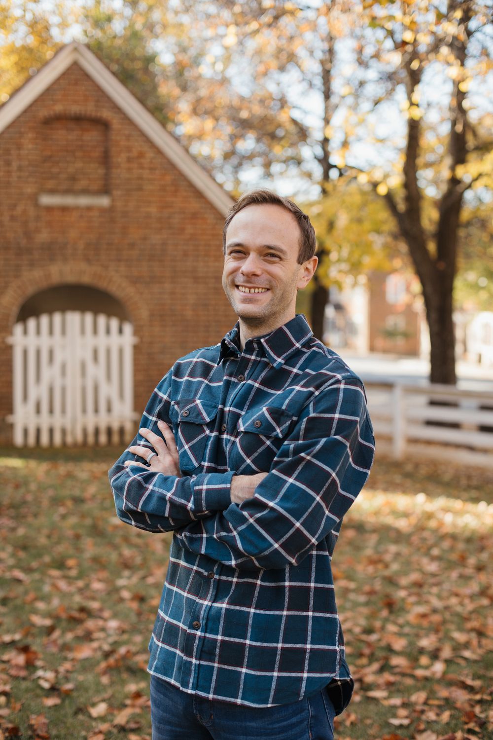 A series of casual outdoor portraits showing expressions of joy against a brick building and autumn leaves.