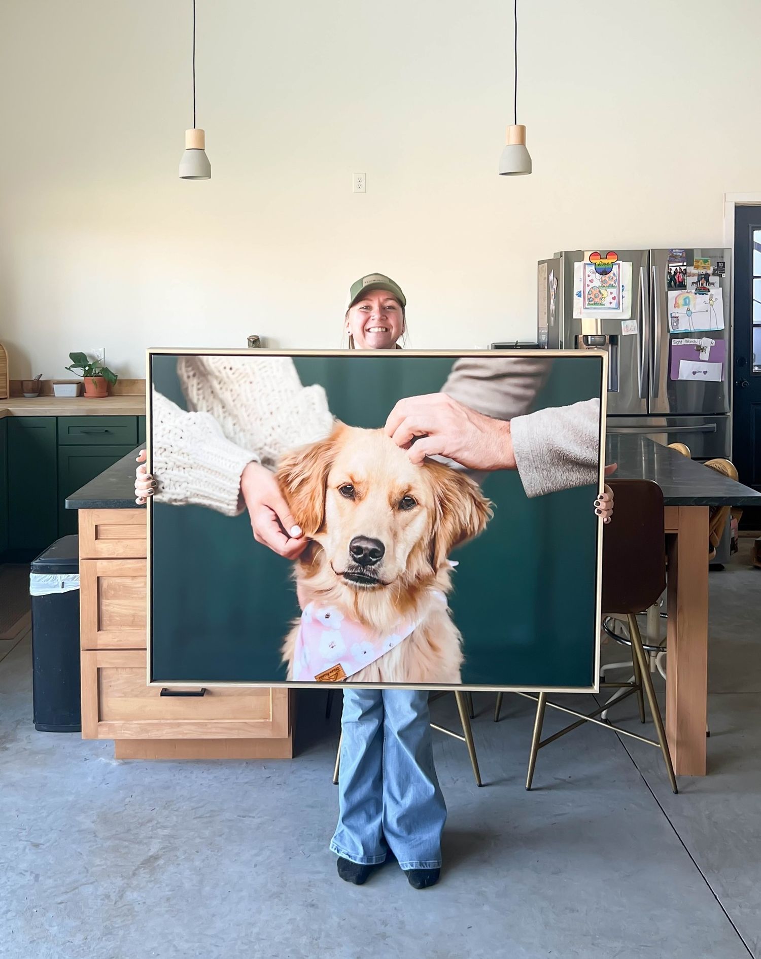 Golden retriever being photographed against a studio backdrop.