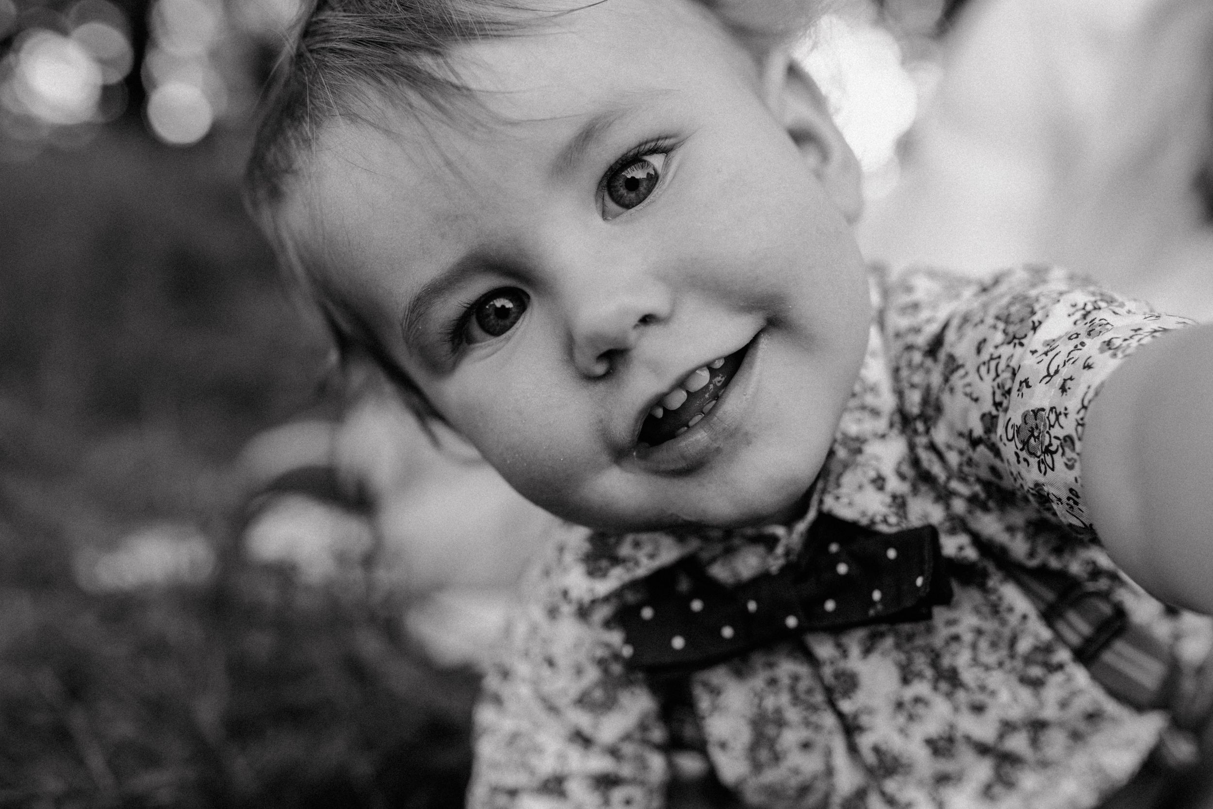 Adorable close-up portrait of a smiling baby during a first birthday session at Jelenovac.