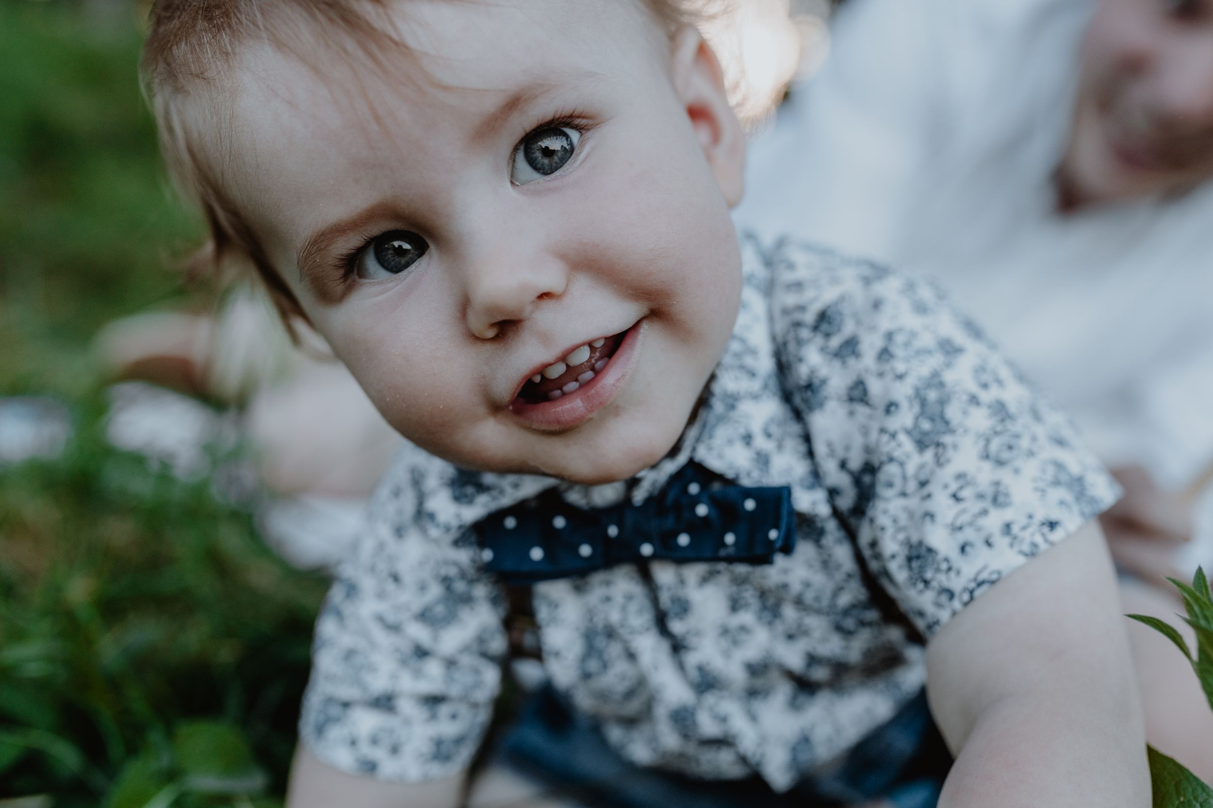 Cute baby with bright eyes, captured in a charming portrait at Jelenovac park.