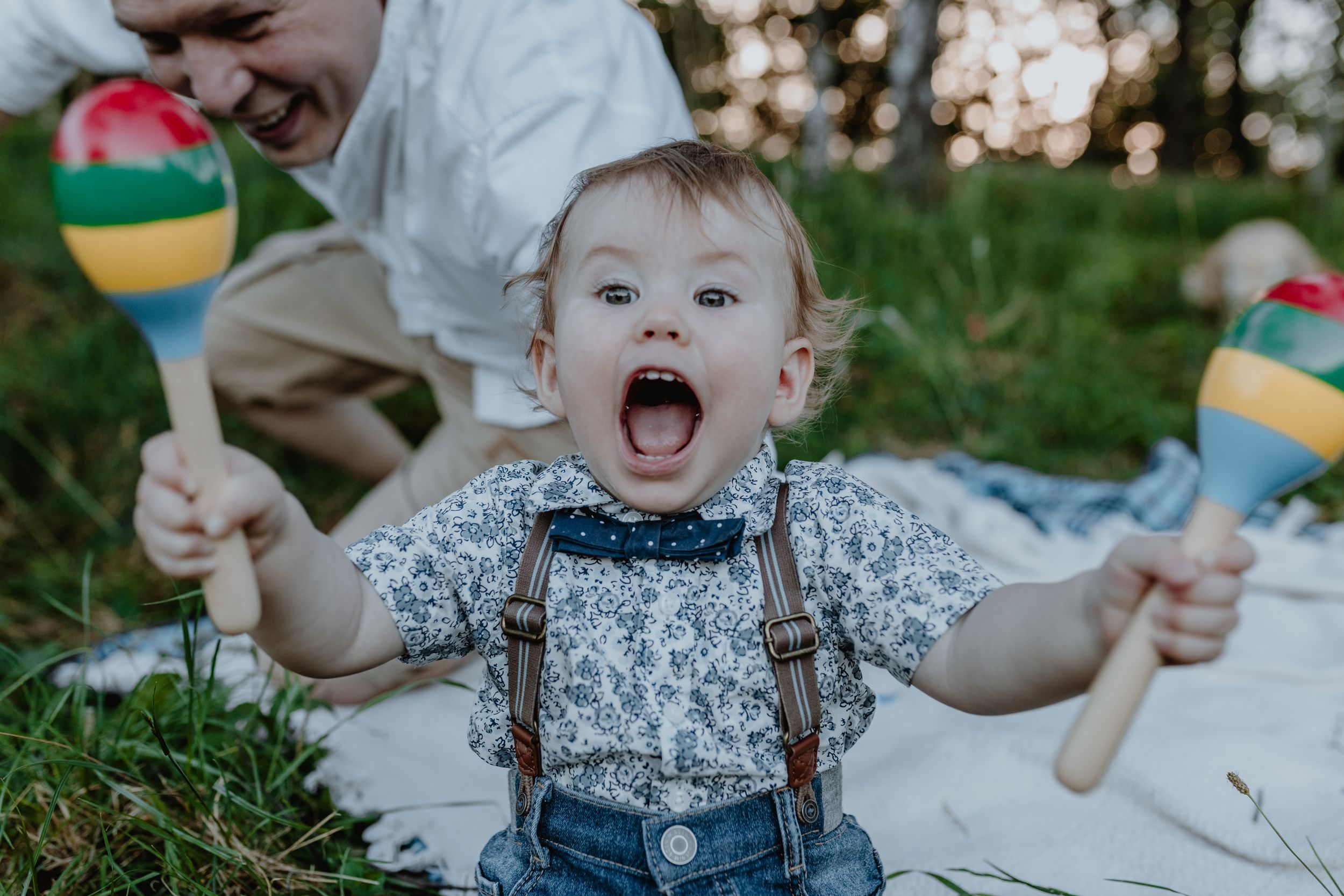 Portrait of a happy baby wearing a blue outfit during a family photoshoot in Zagreb.