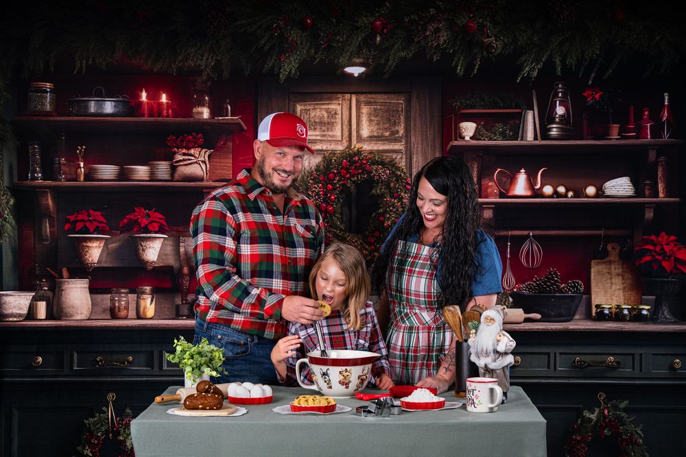 Cozy family dinner scene in dimly lit rustic dining room with red accents.