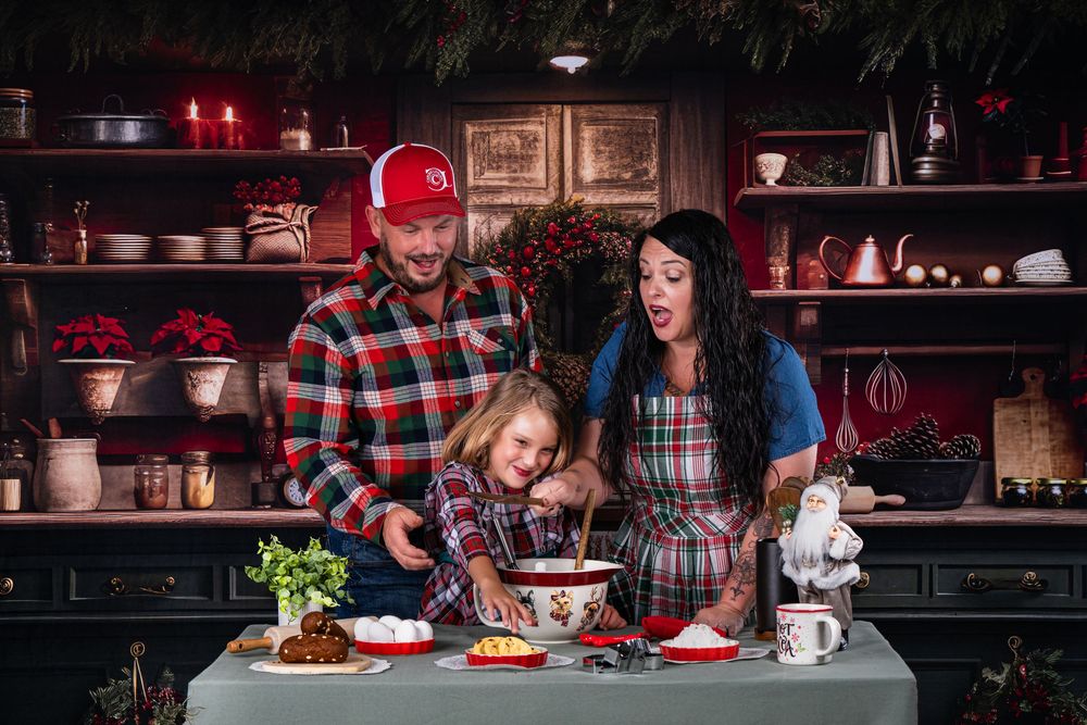 Holiday meal celebration in rustic dining room with red decor and plaid accents.