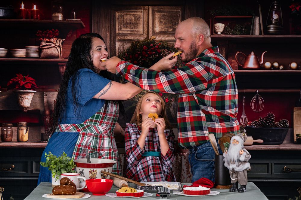A playful cooking scene with family members feeding each other in a festive kitchen.