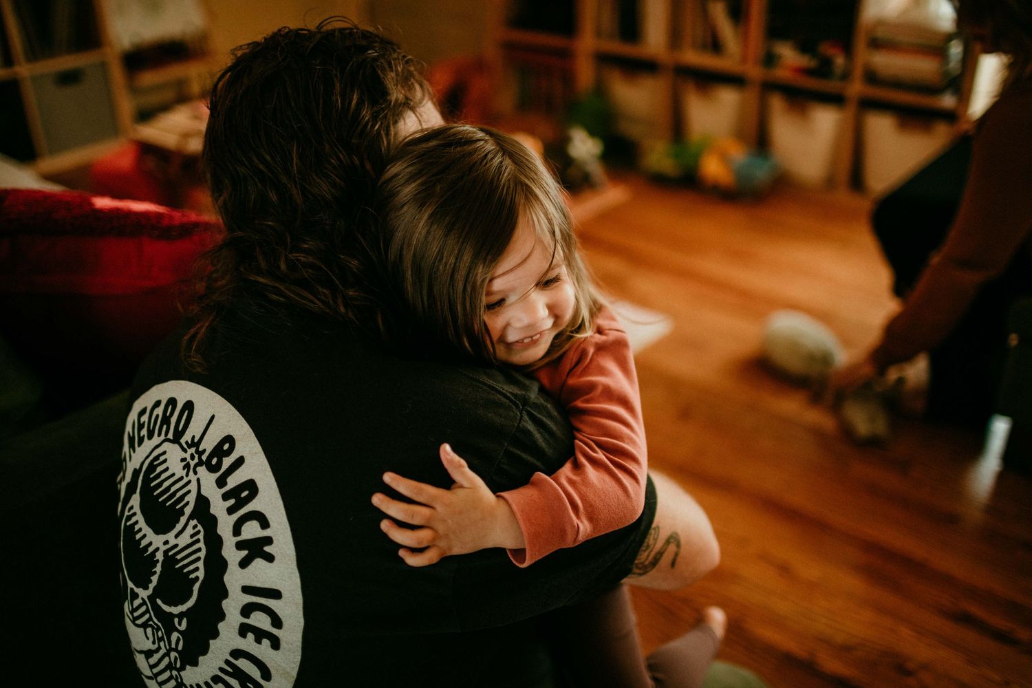 child is hugging father. portland, oregon rushes & waves kimberly marie kimble