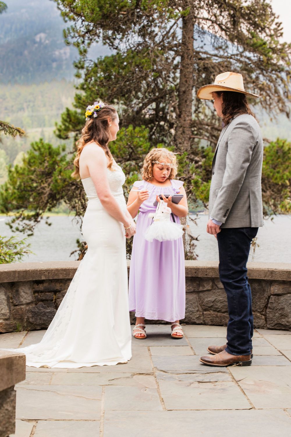 A series of wedding moments captured at an outdoor mountain venue with stone walls and scenic vistas in the background.
