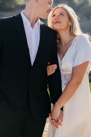 Romantic wedding couple shares intimate moments in a series of cropped photos showing tender embraces in golden sunlight.