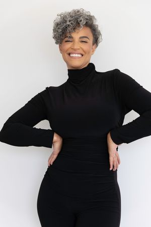 A figure in a black turtleneck and leggings strikes dynamic poses against a white backdrop in a four-part photo series.