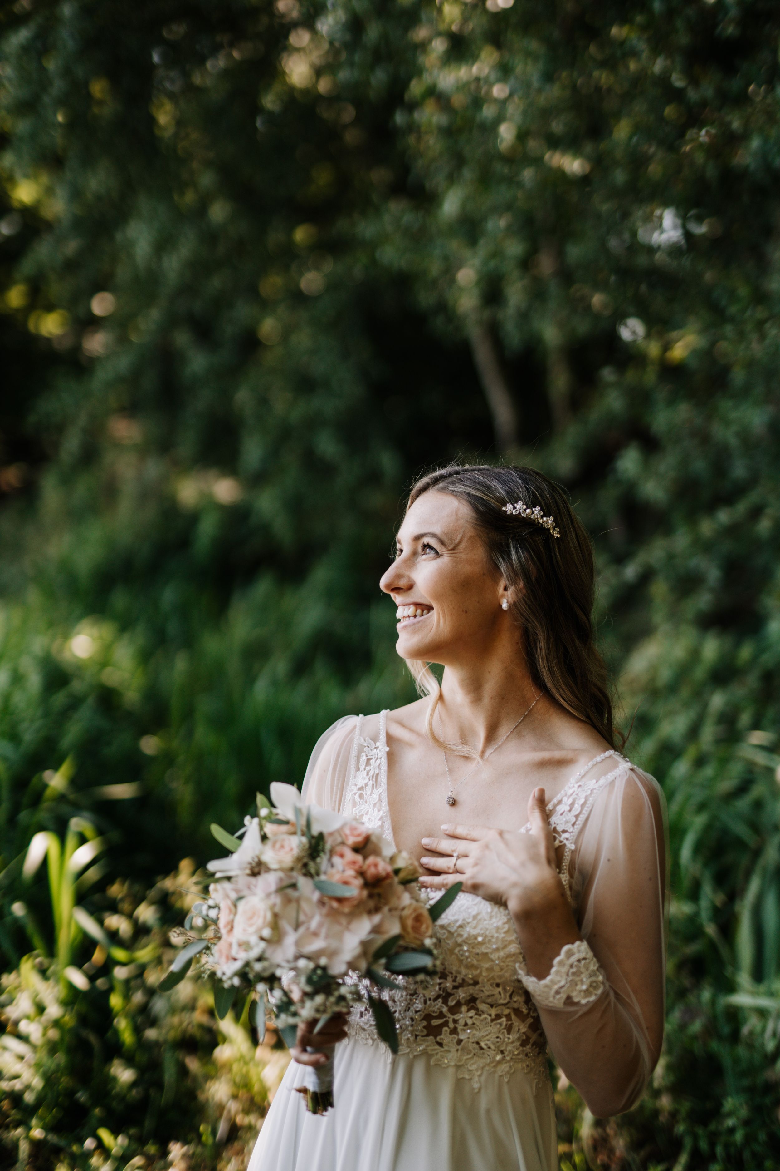 Candid bridal portraits showing joyful moments against lush greenery.