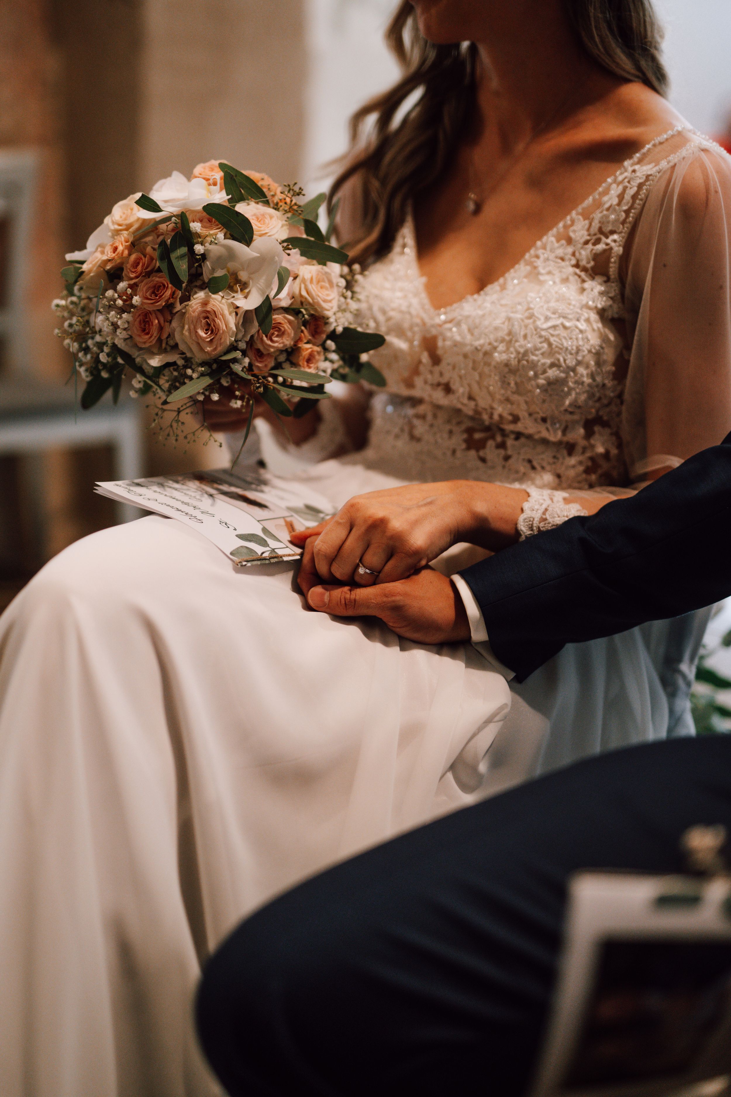 Close-up details of wedding dress lace and floral bouquet arrangements.