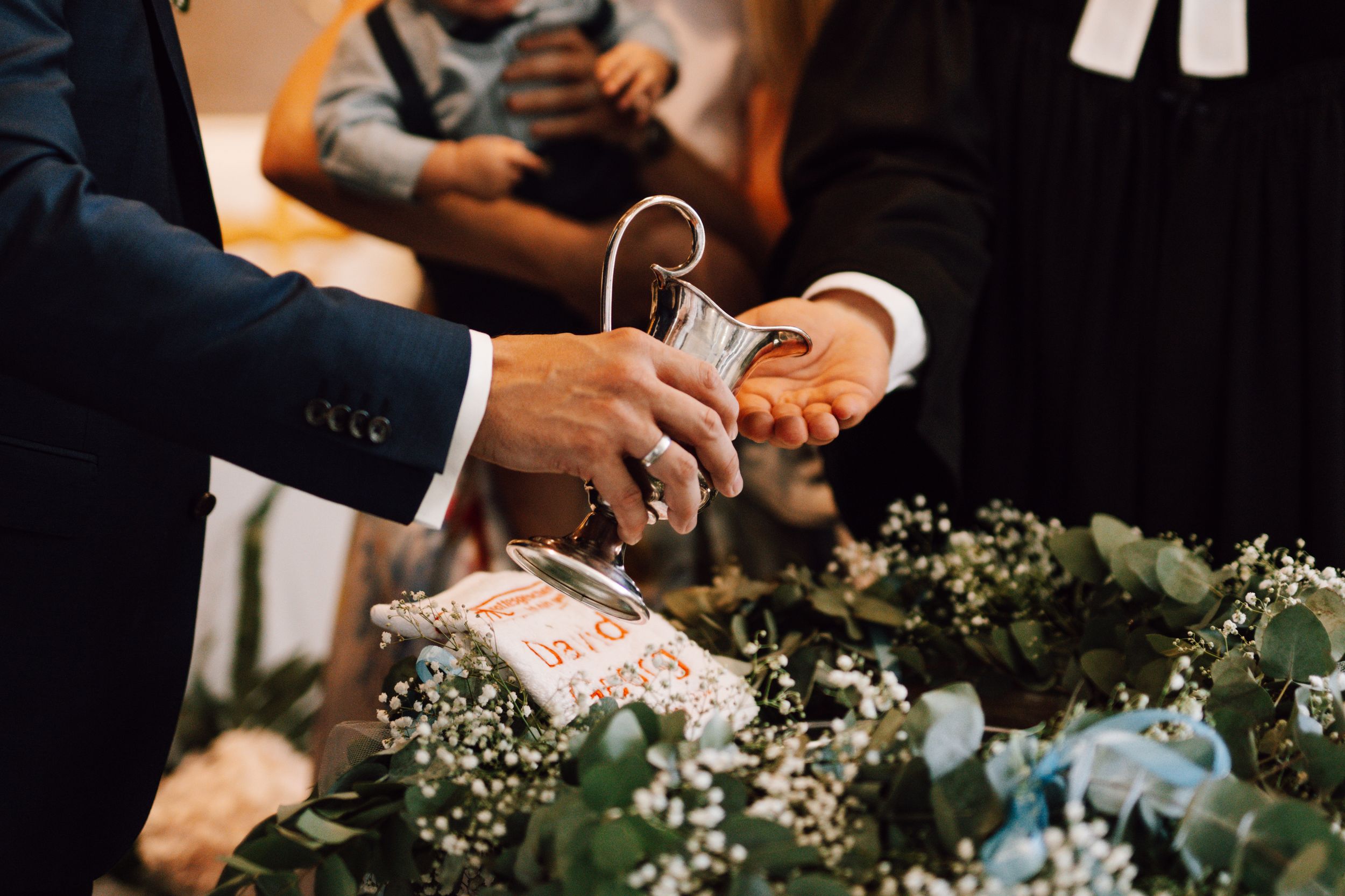 Wedding reception with elegant table settings and floral arrangements.