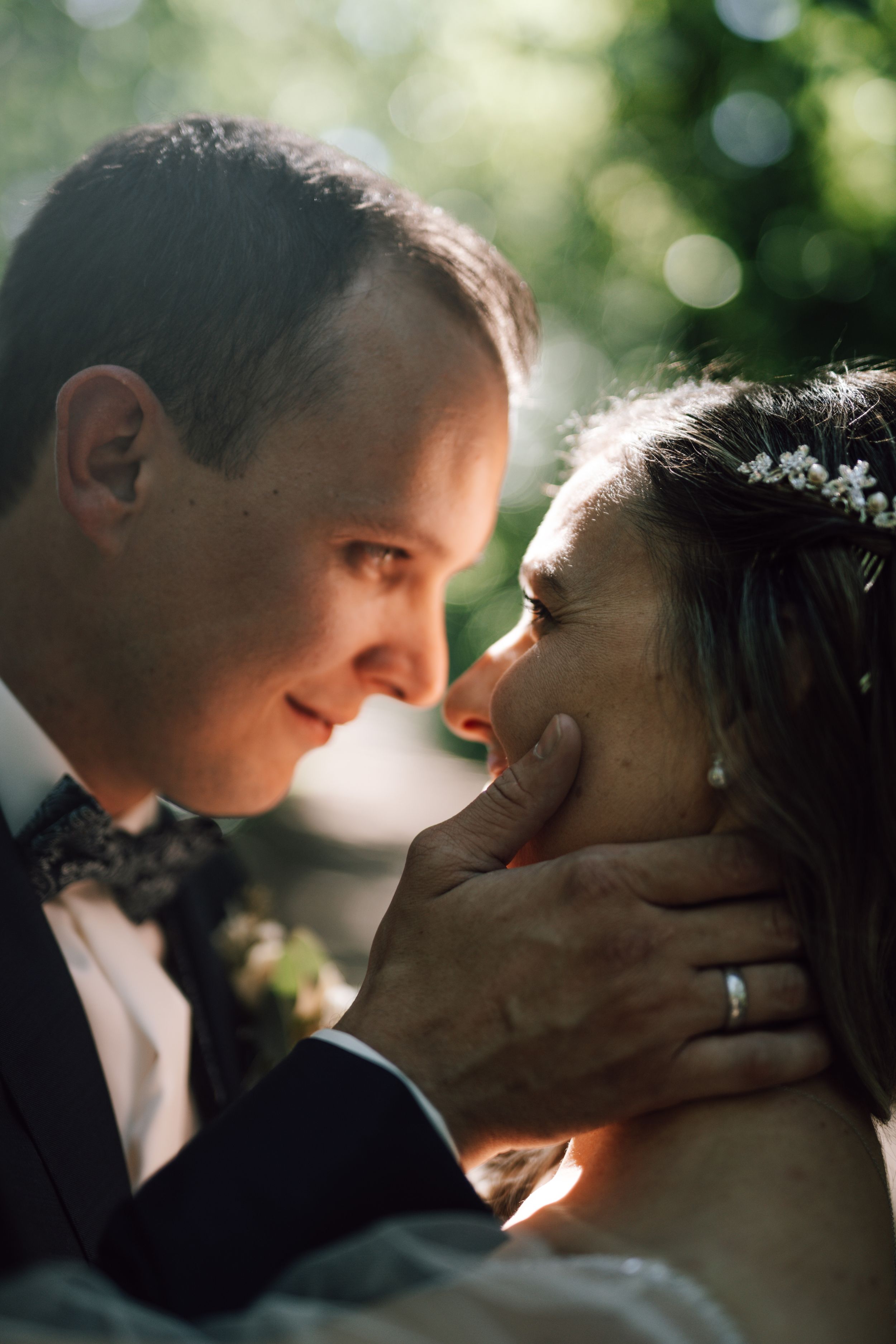 Romantic wedding portraits captured in soft natural lighting with intimate expressions.
