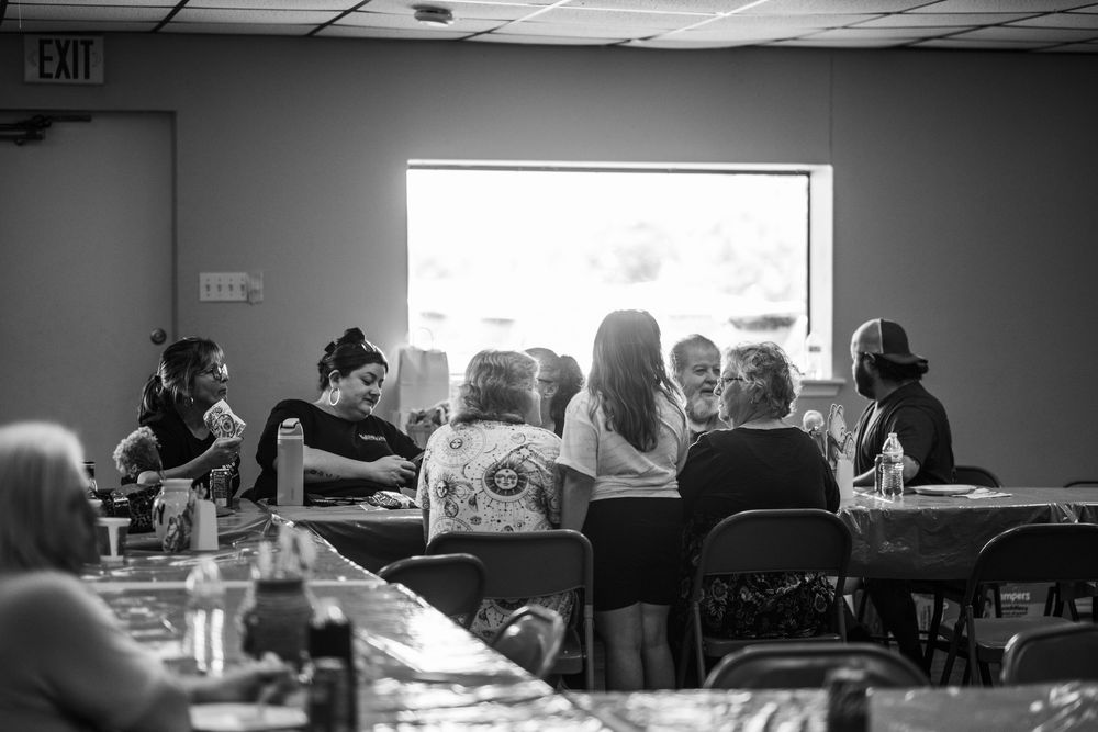 Black and white image of a group gathered together at a baby shower