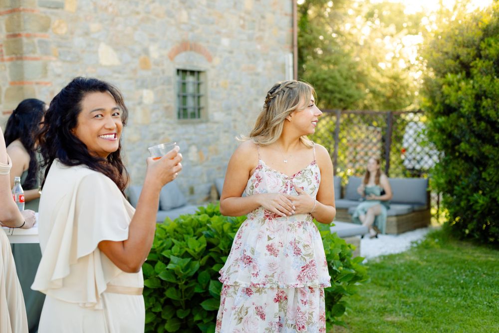 Guests enjoying an elegant outdoor celebration at a stone villa.