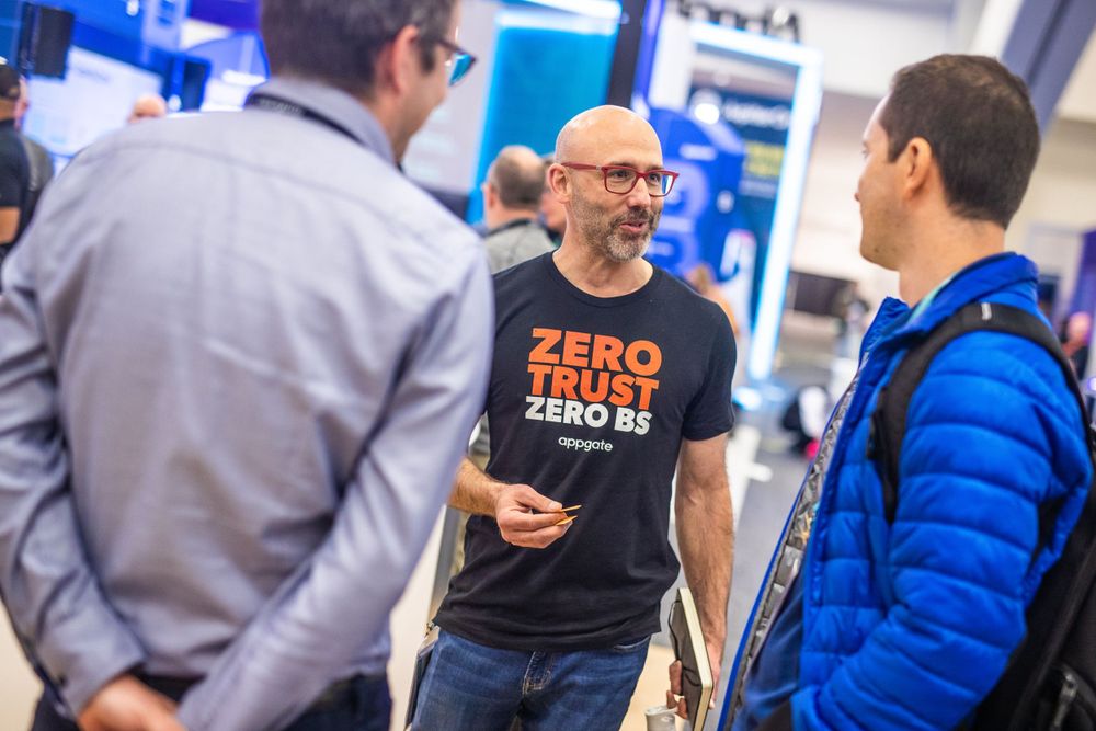 Event attendees networking at a technology conference in San Francisco, CA