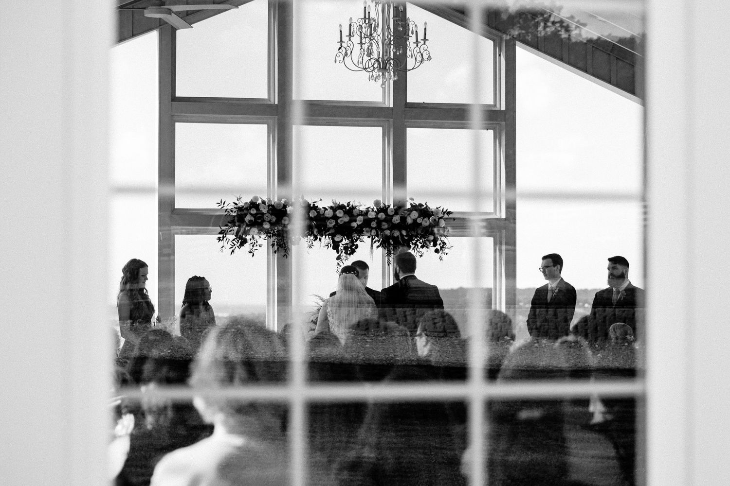 A black and white photo through a window at Lakeview Hills wedding venue in Salina, Oklahoma.
