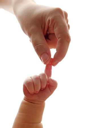A baby's tiny hand gripping an adult's index finger against a white background, symbolizing trust and parental bond.