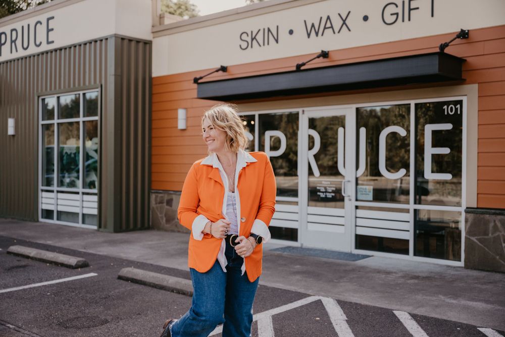 Retail storefront exterior of Spruce Skin Wax Gift shop with modern signage.
