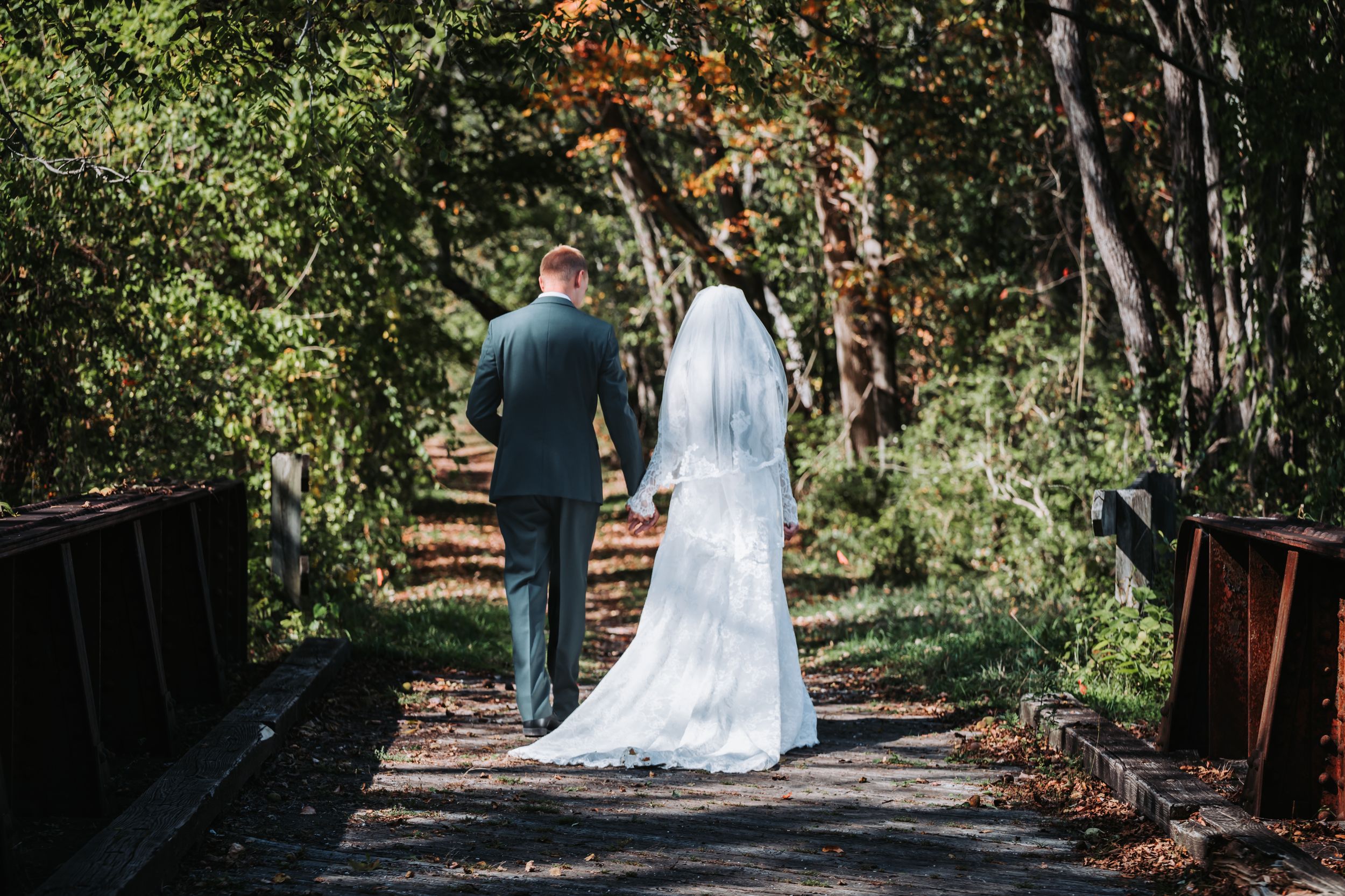 Bride and Groom walking in the park for first look in Sussex County New Jersey