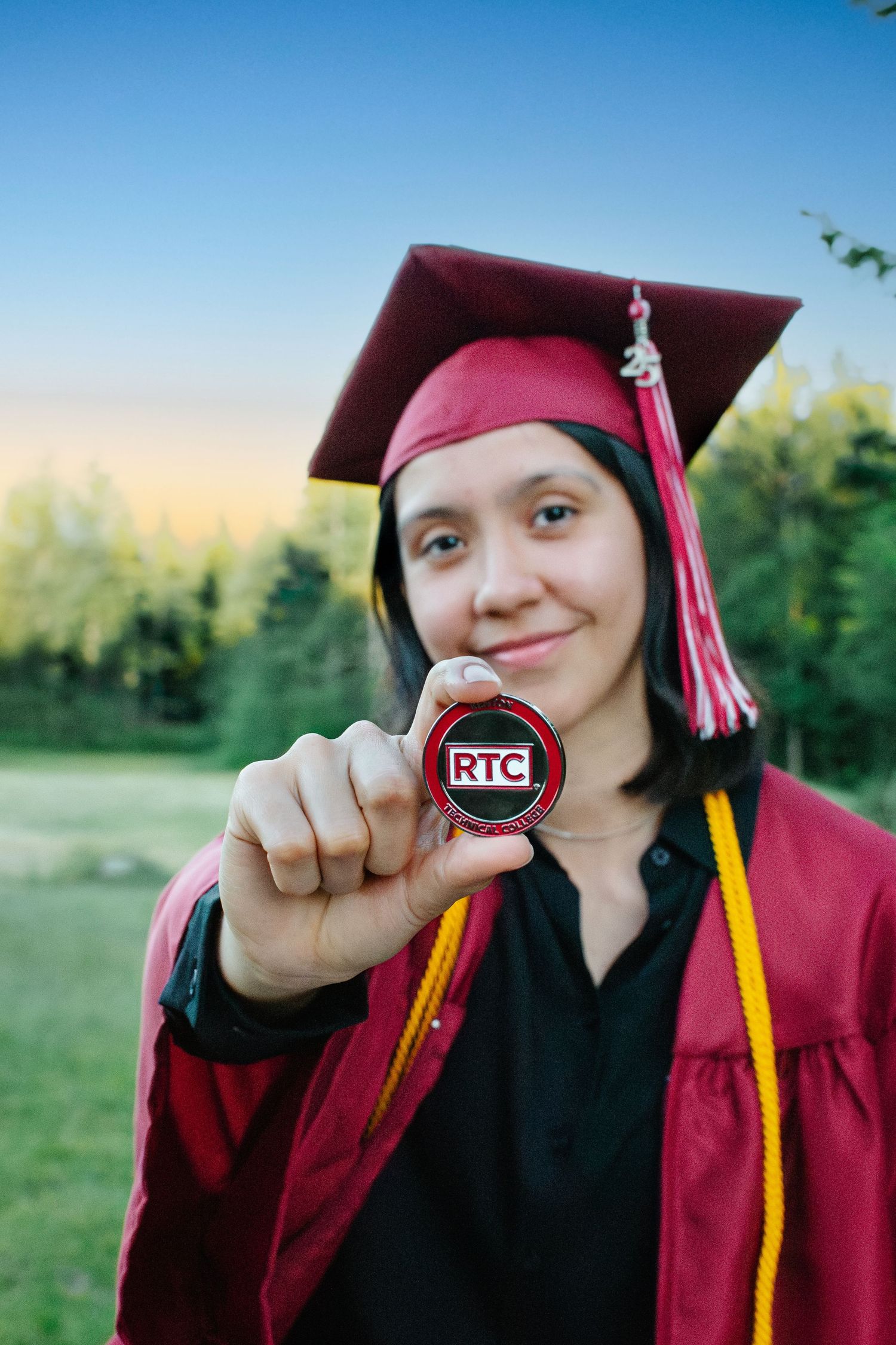 Cybersecurity graduate holding career-related item during personalized graduation portrait session an hour from Seattle, Washington
