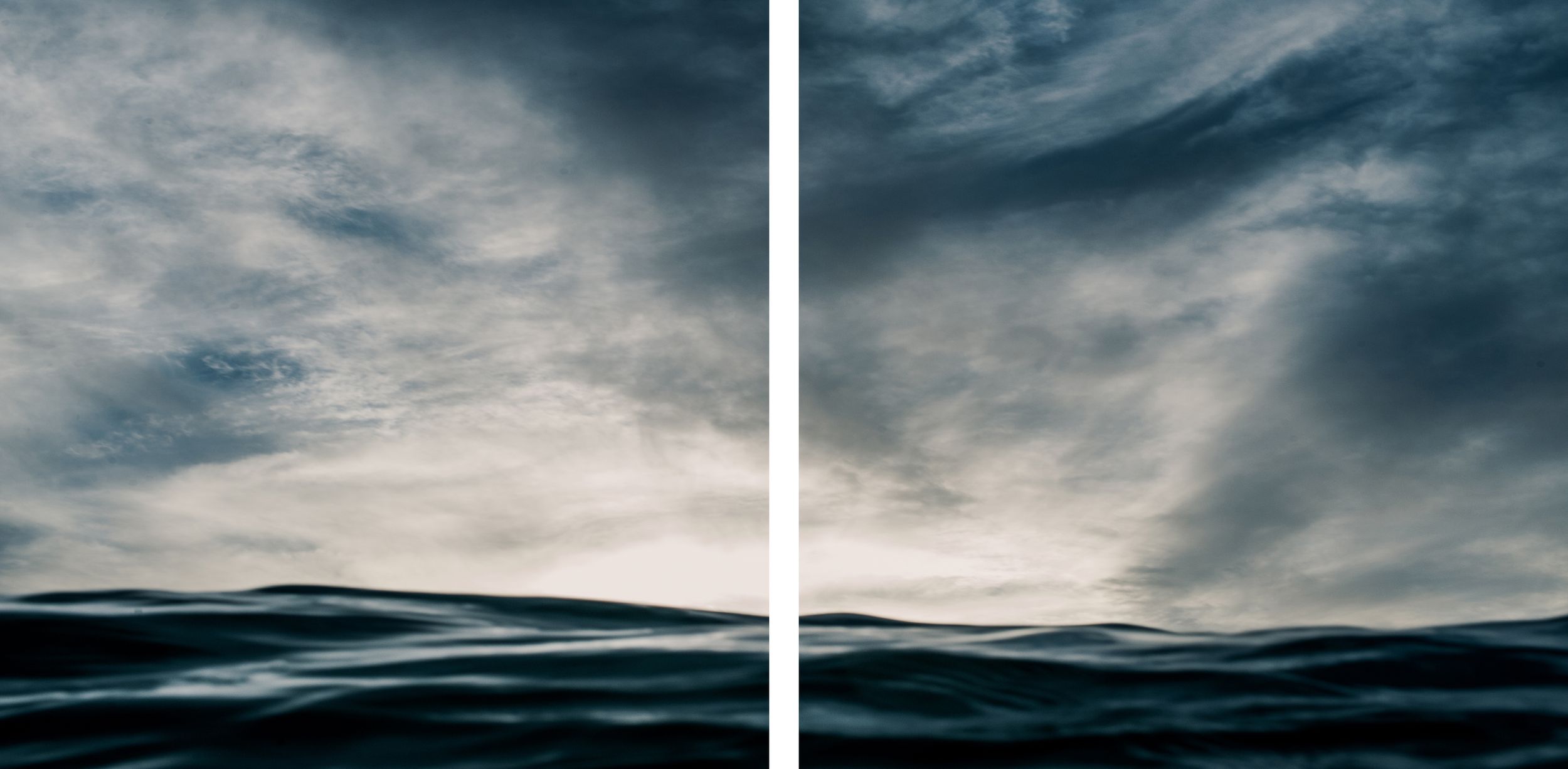 A dramatic diptych painting of dark ocean waves beneath a moody, cloud-filled sky in deep blue and grey tones.