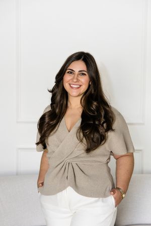 Professional branding headshot of commercial photographer Vera Mey in a bright modern studio space in Stuart, Florida.