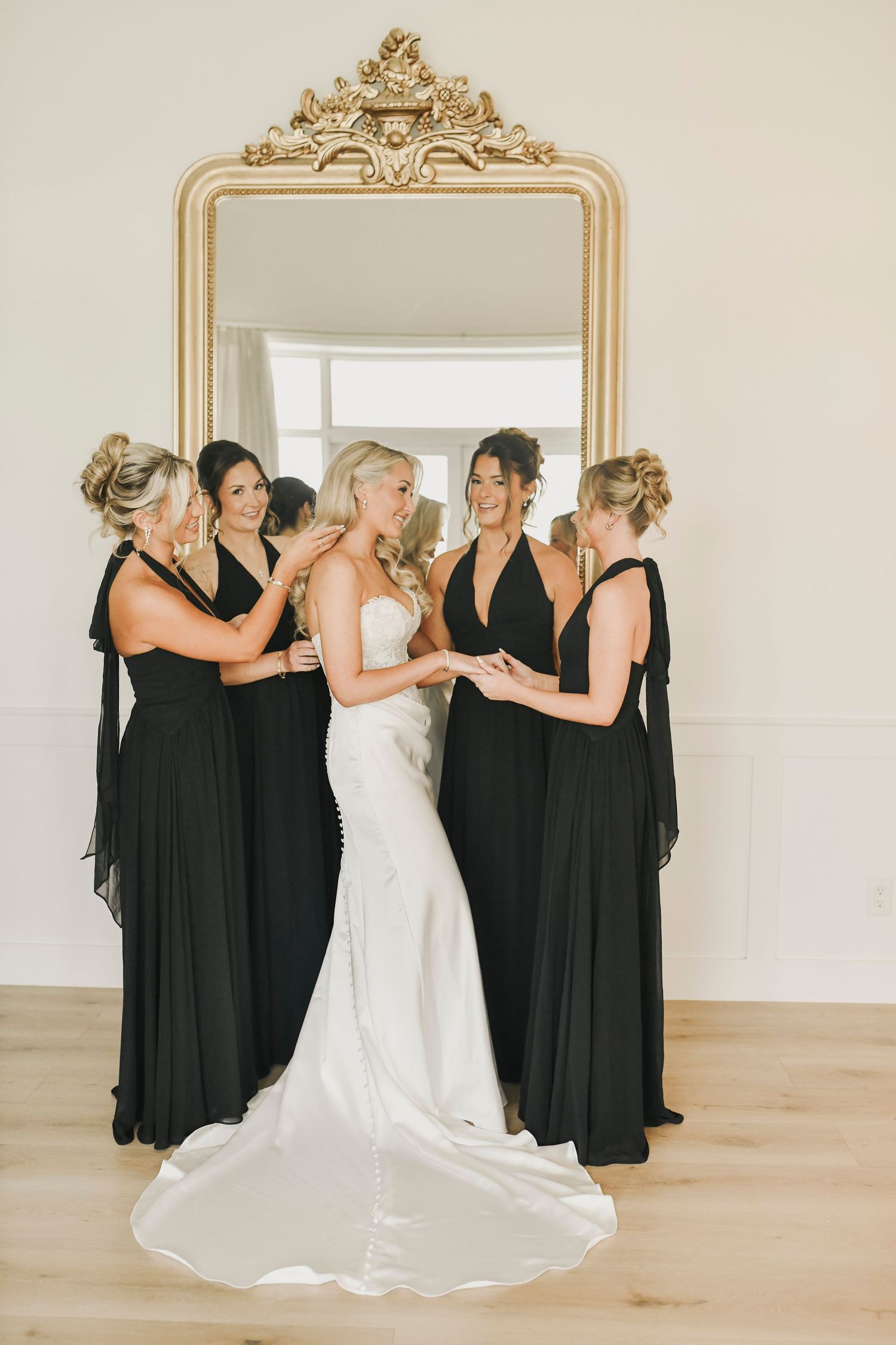 Bride putting on wedding dress in natural light