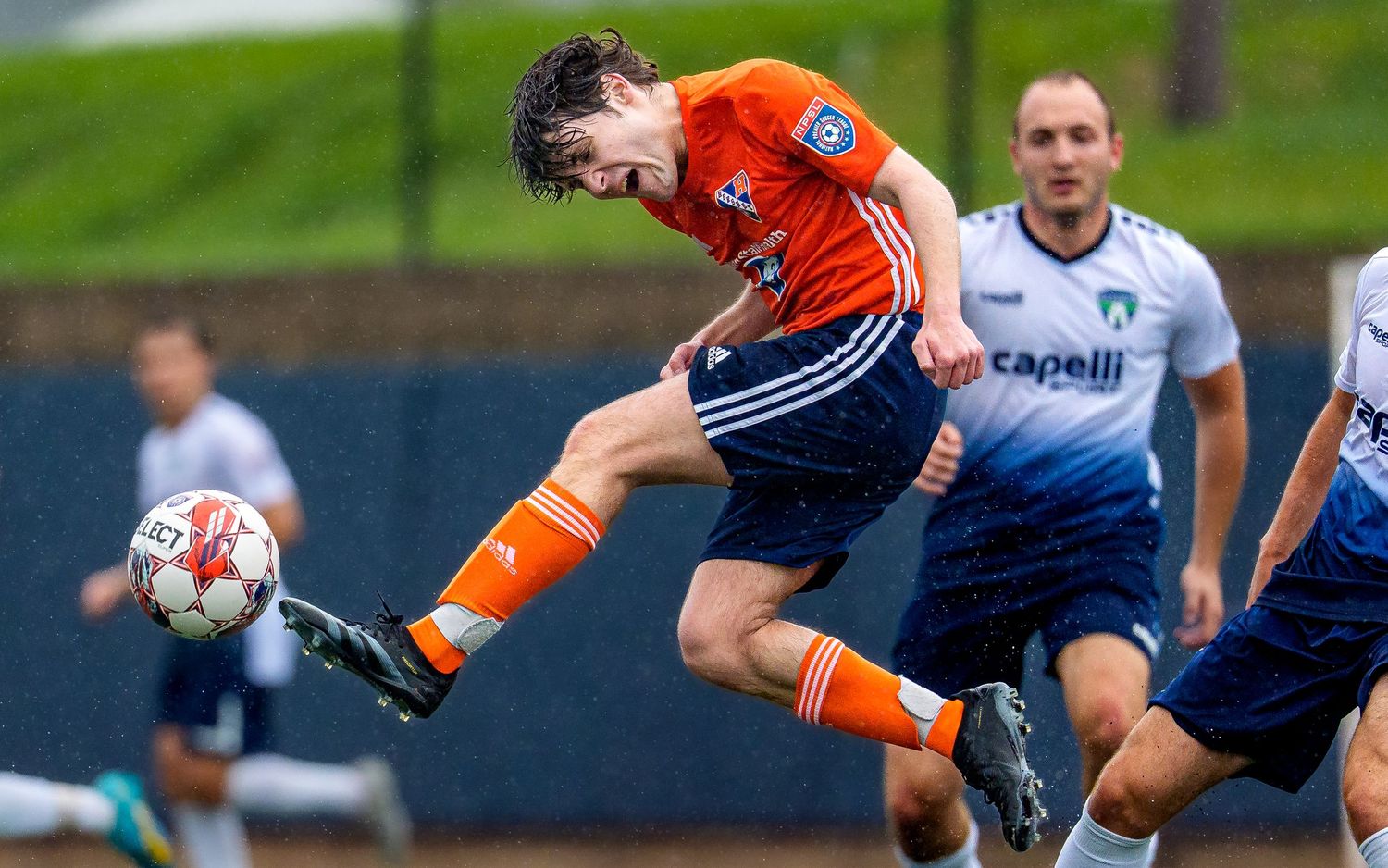 Hershey FC player makes a mid-air volley in an NPSL men's soccer match, by Deanna Fox, SportsFox Photography, Hershey PA