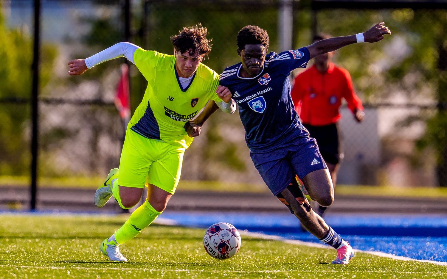 Hershey FC player and a defender compete for the ball, NPSL men's soccer, by Deanna Fox, SportsFox Photography, Hershey PA