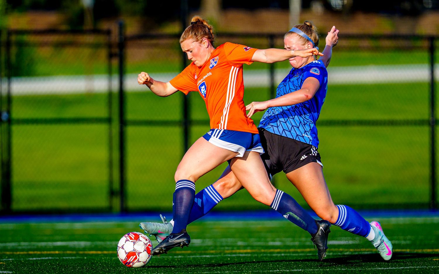 Hershey FC player battles for the ball in a WPSL women's soccer match, by Deanna Fox, SportsFox Photography, Hershey PA