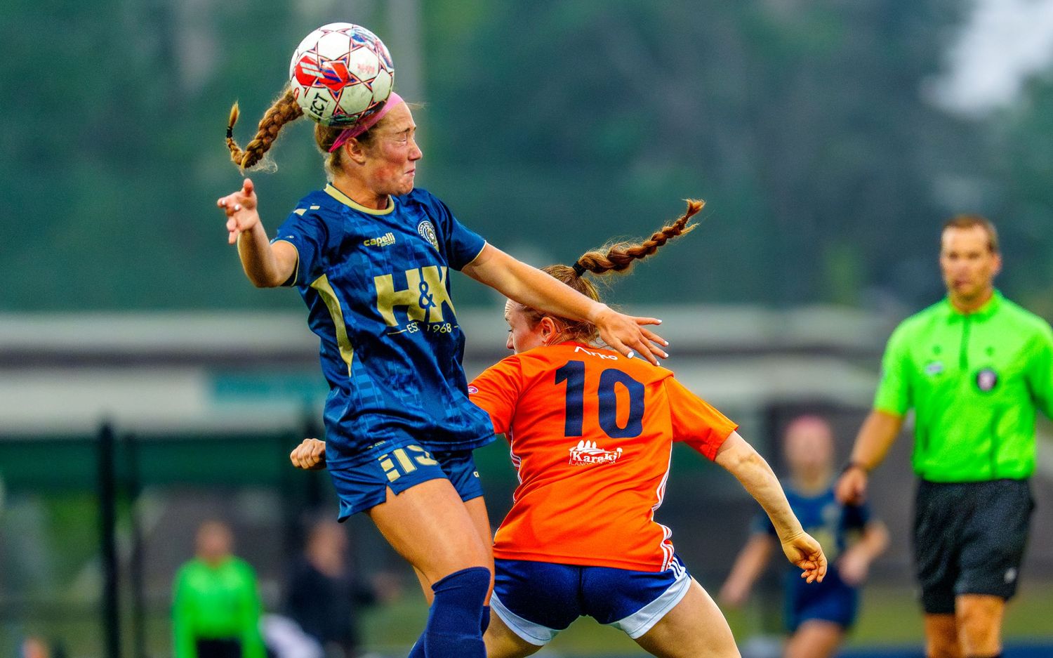 Reading FC player heads the ball in a WPSL women's soccer match, by Deanna Fox, SportsFox Photography, Hershey PA