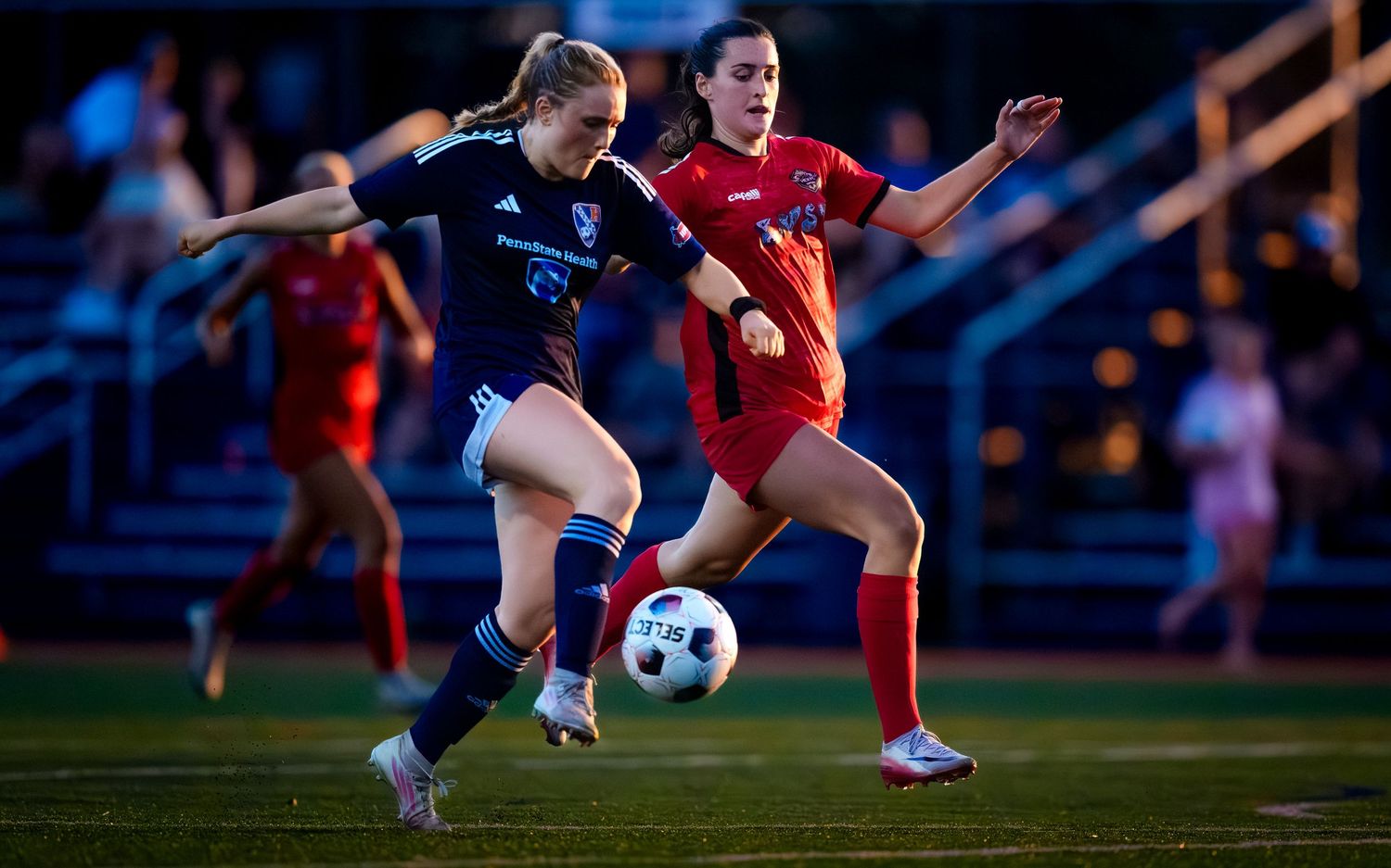 Hershey FC player battling for the ball in a WPSL women's soccer match, by Deanna Fox, SportsFox Photography, Hershey PA