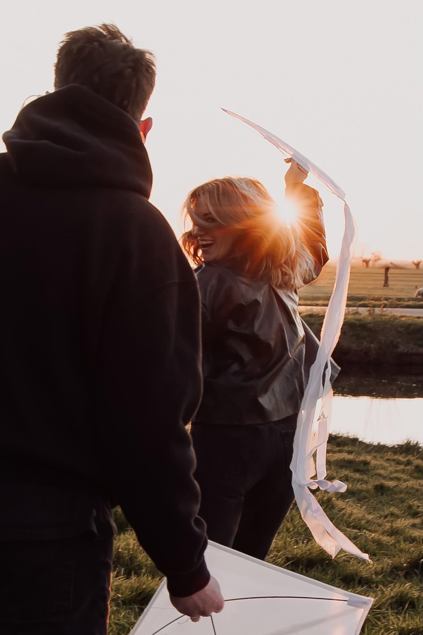Golden hour couple photography showcasing movement, laughter, and genuine connection.