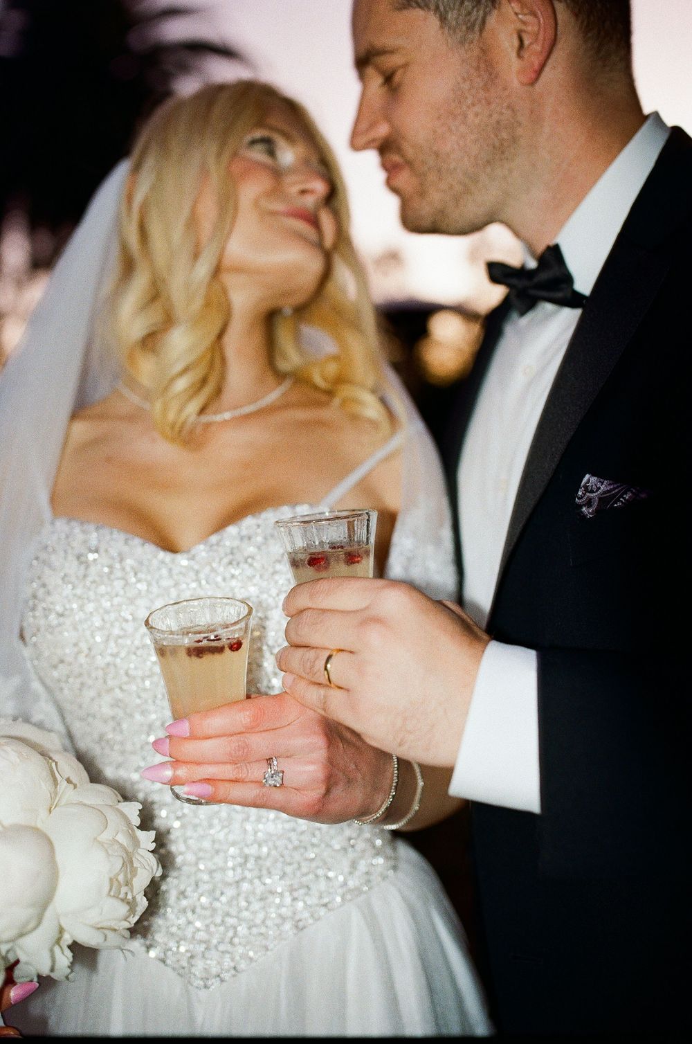 35mm film direct flash portrait of a modern couple. Low-stress after-party vibe by a Concord NC photographer.